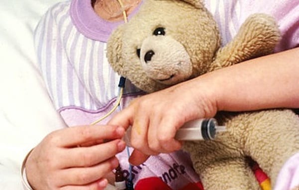 400px-Young_patient_holds_teddy_bear