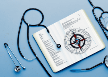 A stethoscope intertwined with a compass